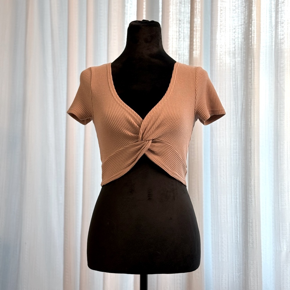 This Hey Babe crop top (medium), snug fit, front knot, warm caramel color.
